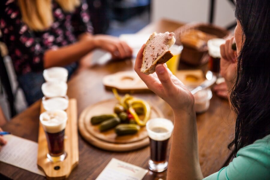 People and beer samples on beer tour in Bratislava